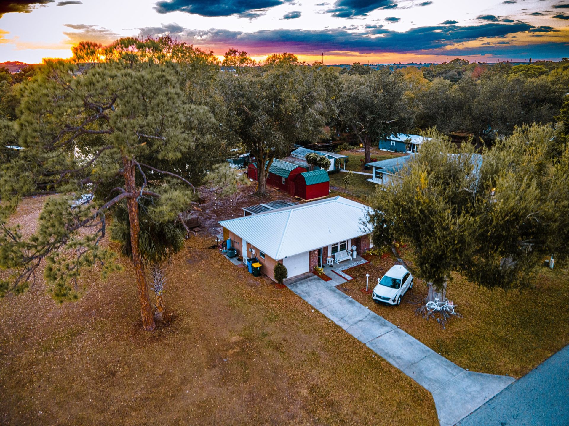Aerial sunset view of Lake Clay Dream Away vacation rental home in Lake Placid, Florida